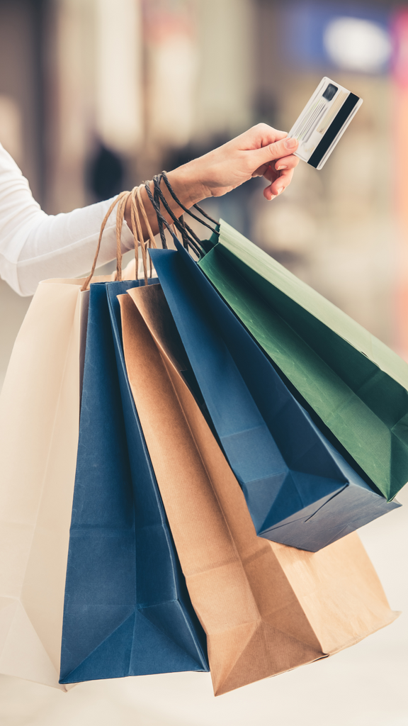 Holding shopping bags and credit card