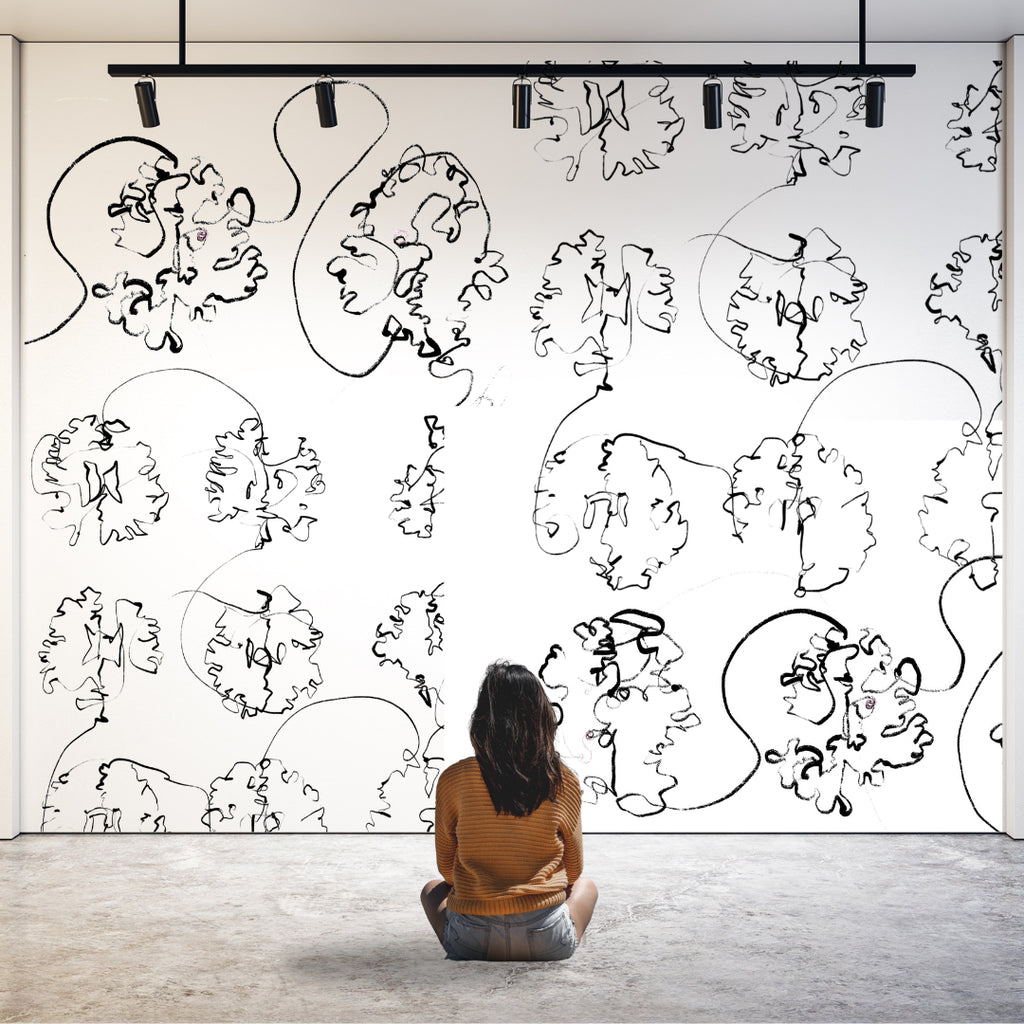 Lindsey sitting in front of mural