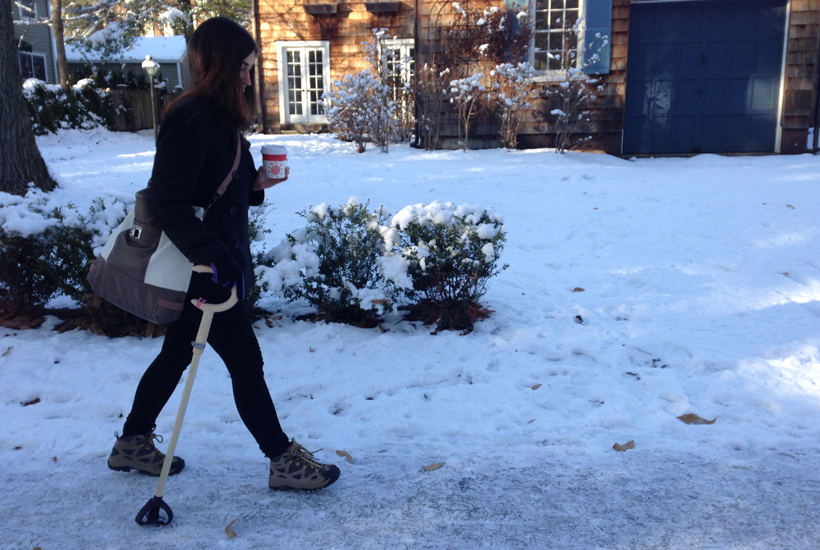 walking with cane on snowy ground