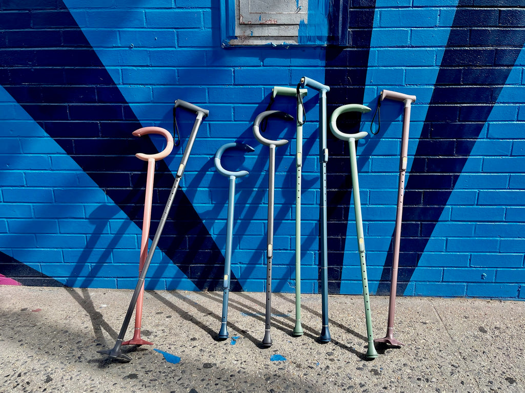 C-Grip and quick fold canes in all colors leaned against mural